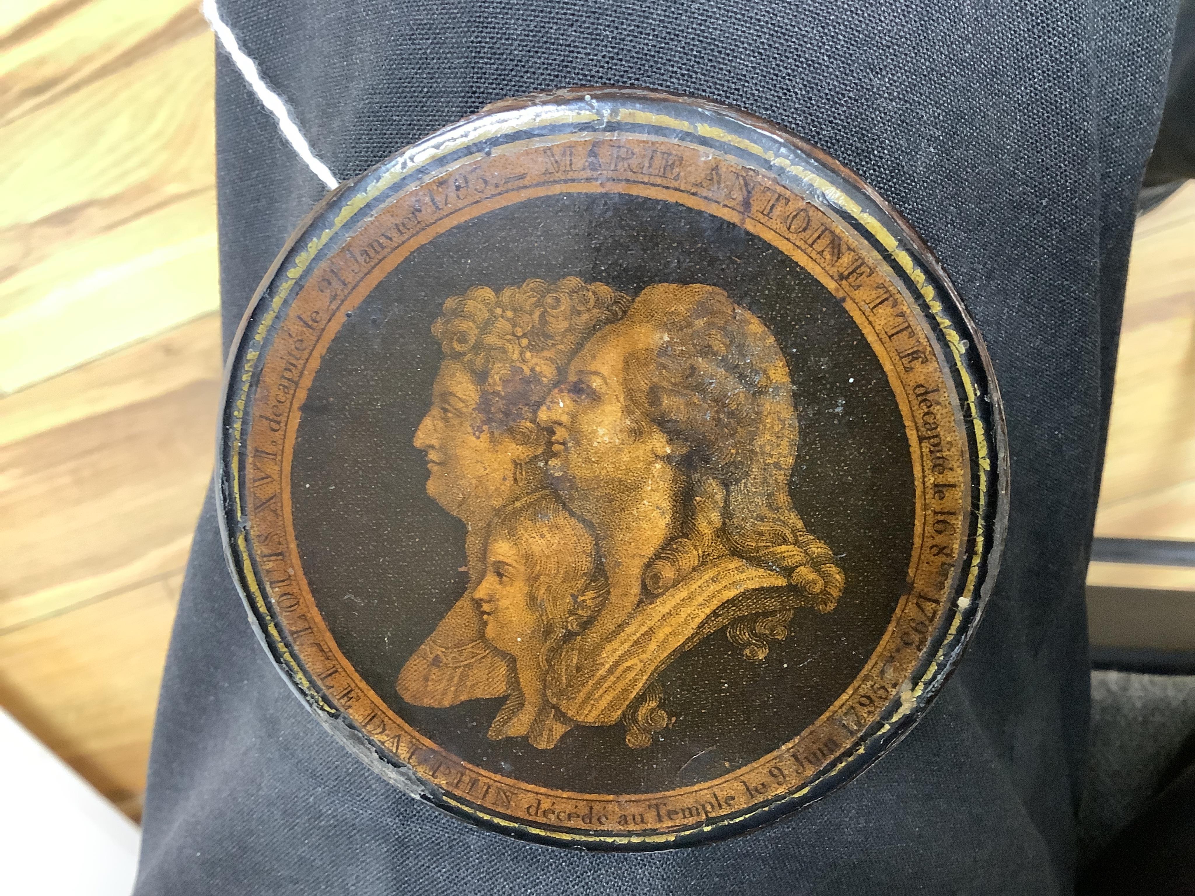 Death of Louis XVI and Marie Antoinette, a commemorative papier mache snuff box, 9cm diameter. Condition - some chipping and wear to edges, part of rim of cover missing